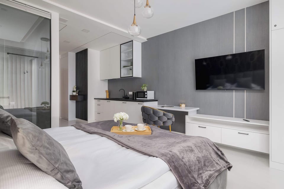 Enjoy your favorite shows on the flat-screen television in the elegant living area.