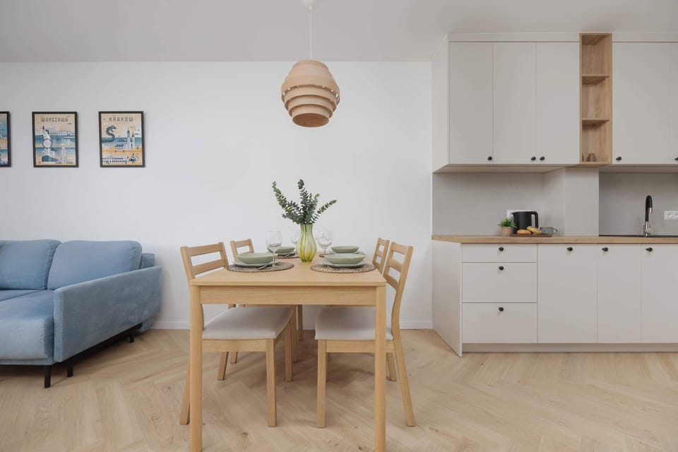 Modern kitchenette with a dining table.