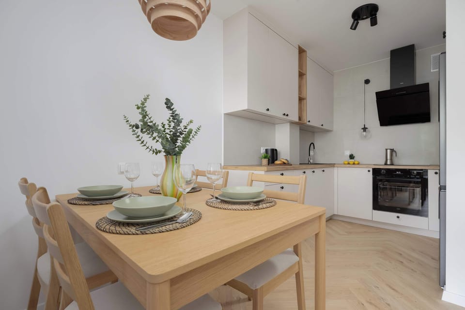 Bright kitchen corner with a table for meals.