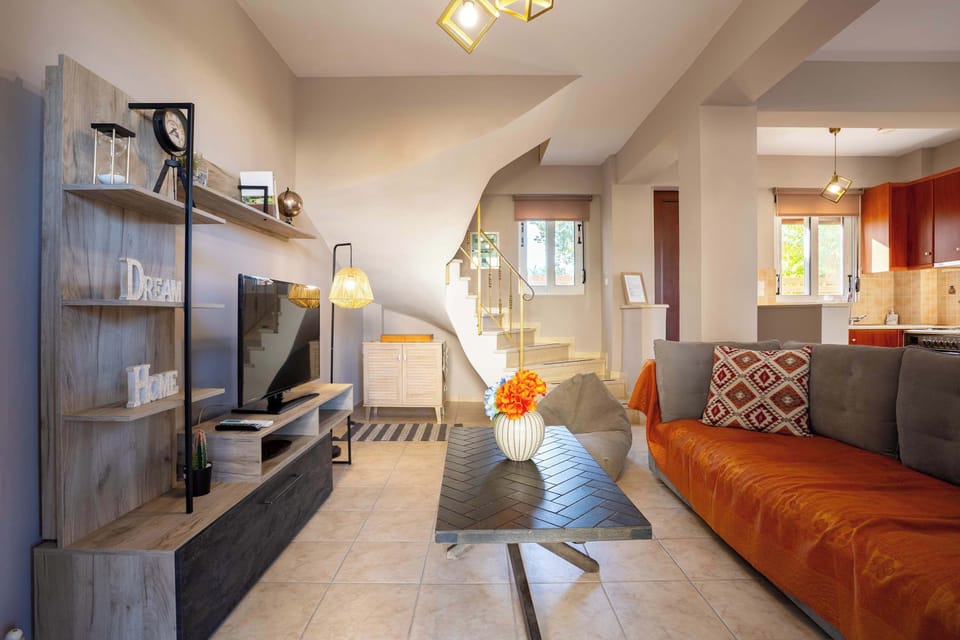 Open-Plan Interior Layout Showing the Seamless Connection Between Kitchen, Dining Area, and Living Room
