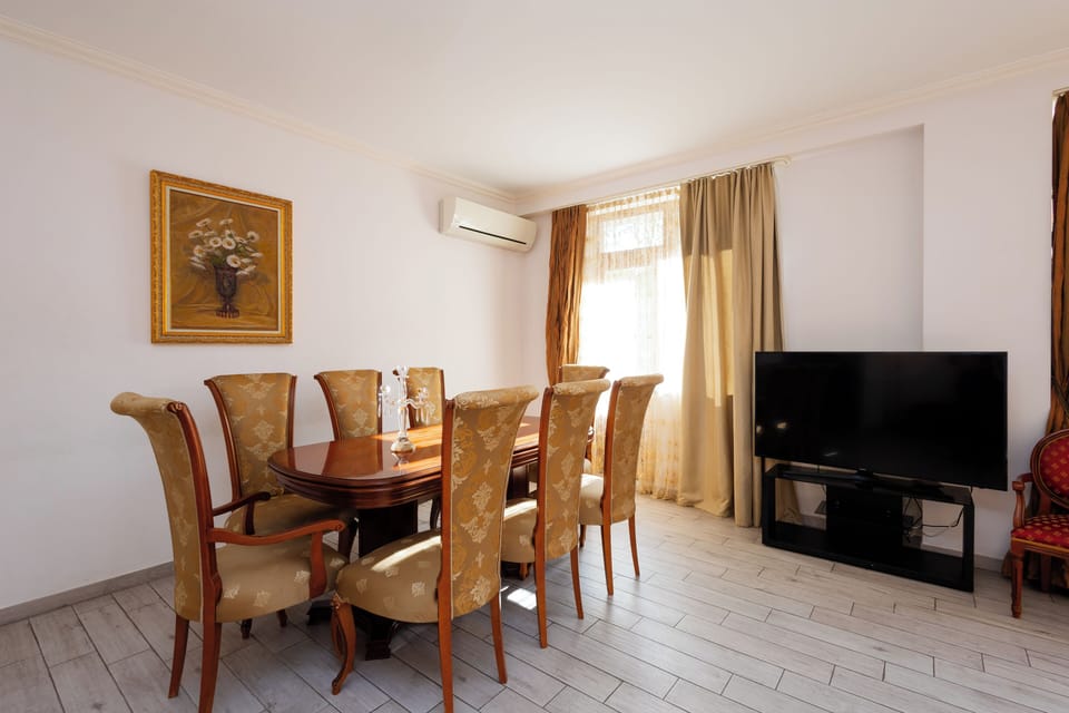 Deluxe Apartment, Balcony, Park View | Living area | 50-inch flat-screen TV with cable channels