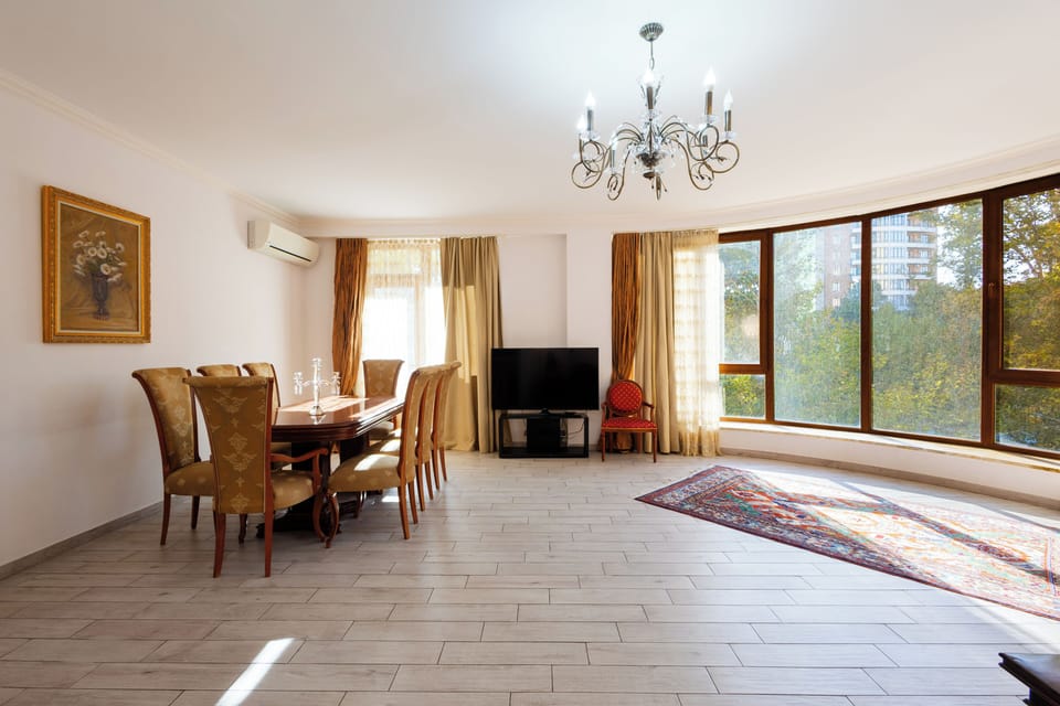 Deluxe Apartment, Balcony, Park View | Living area | 50-inch flat-screen TV with cable channels