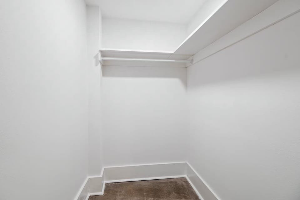 Large walk-in closet attached to the bedroom.