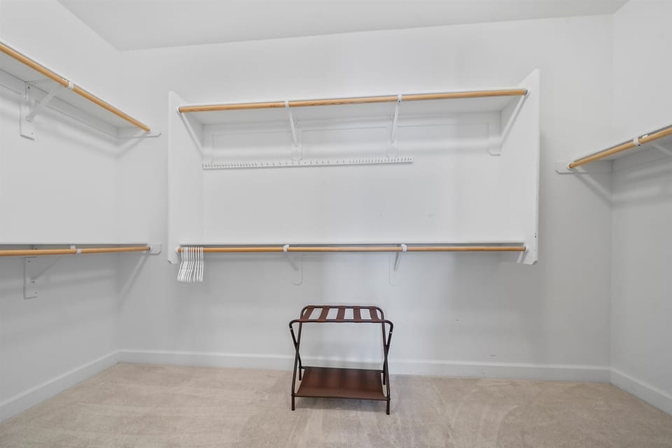 The large walk-in closet offers plenty of storage space, keeping your belongings organized and the bedroom clutter-free.