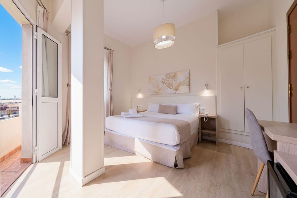 Comfort Double Room, City View | In-room safe, desk, blackout drapes, iron/ironing board