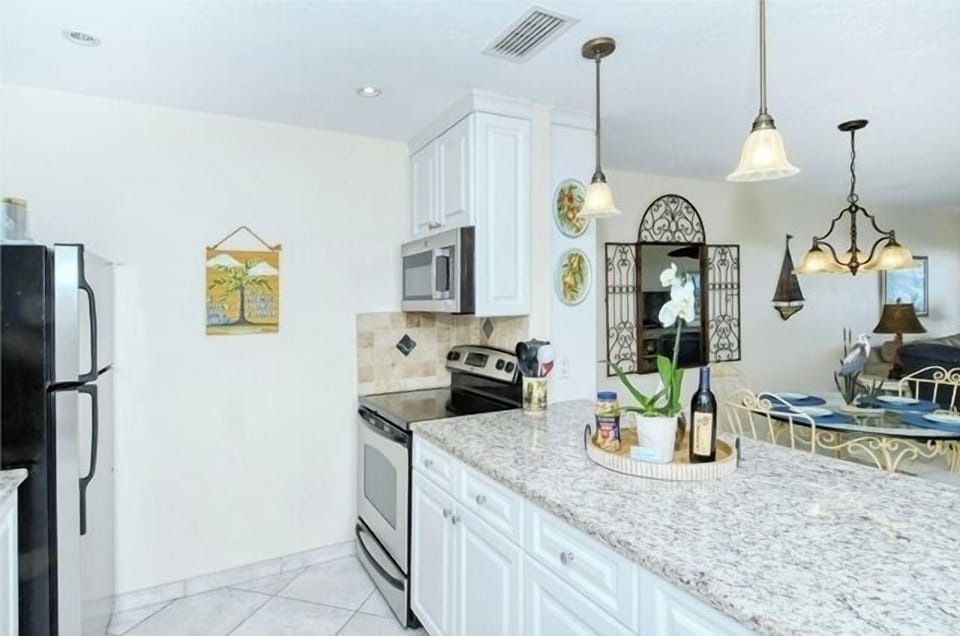 Kitchen - Updated, open kitchen with granite counter tops.