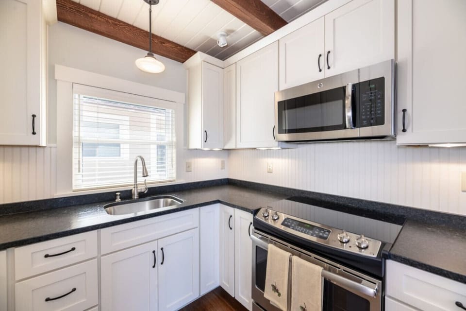 Fully equipped kitchen with plenty of counter space and natural light.