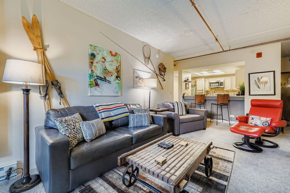 Comfortable Living Area with Modern Seating and queen and twin pull-out beds.