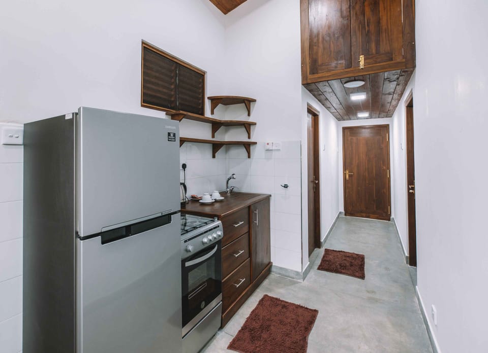 Deluxe Apartment, Balcony, Garden View | Private kitchen | Highchair