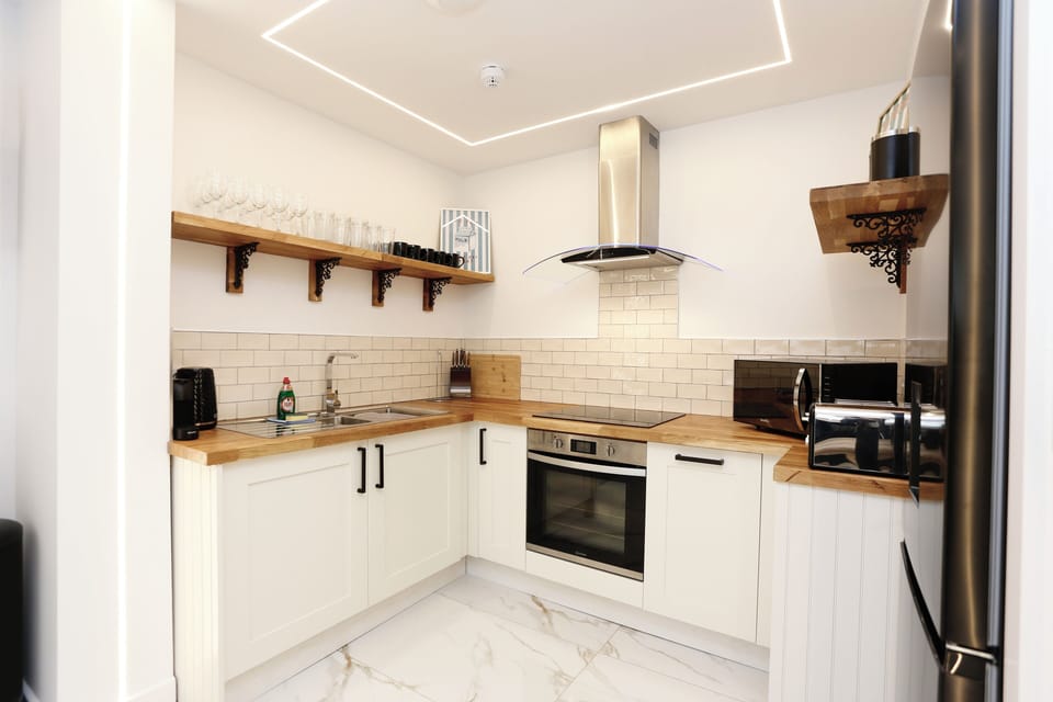 Coffee corner stocked with pods and milk for your first morning brew.