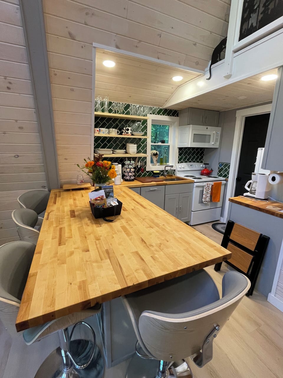 We've got a beautiful birch wood countertop island that can seat 4 people.