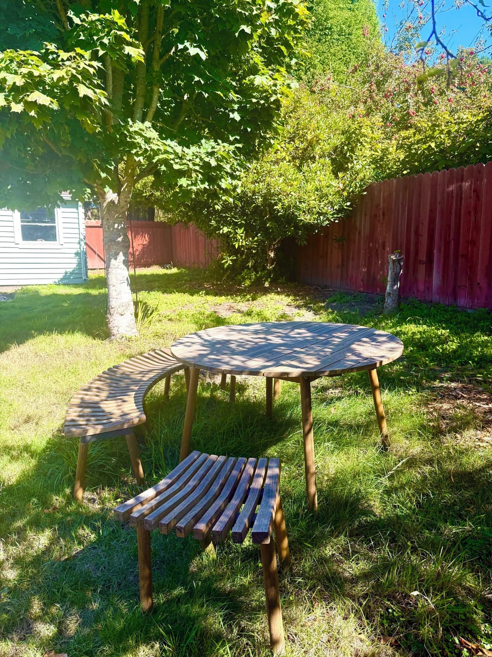 Private backyard with BBQ, outdoor dining, and Adirondack chairs