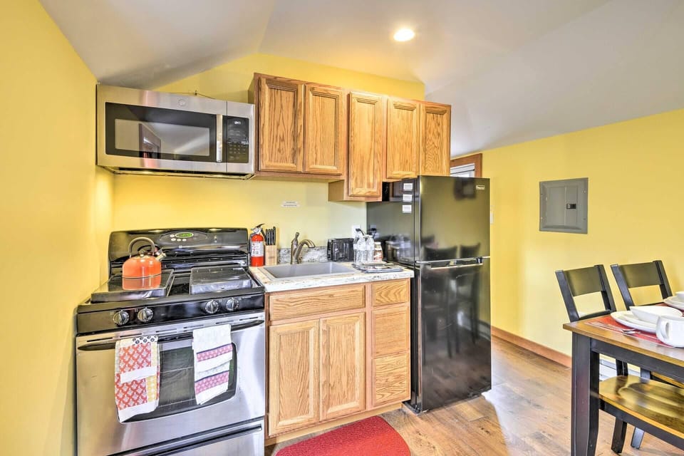 Cozy kitchen with modern appliances and warm wood cabinets