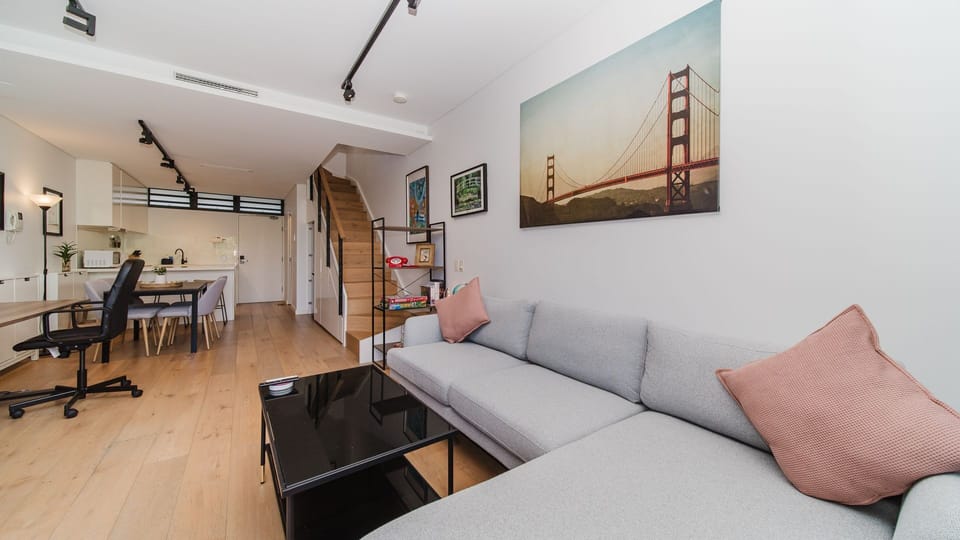 Open living area with sofa and TV.