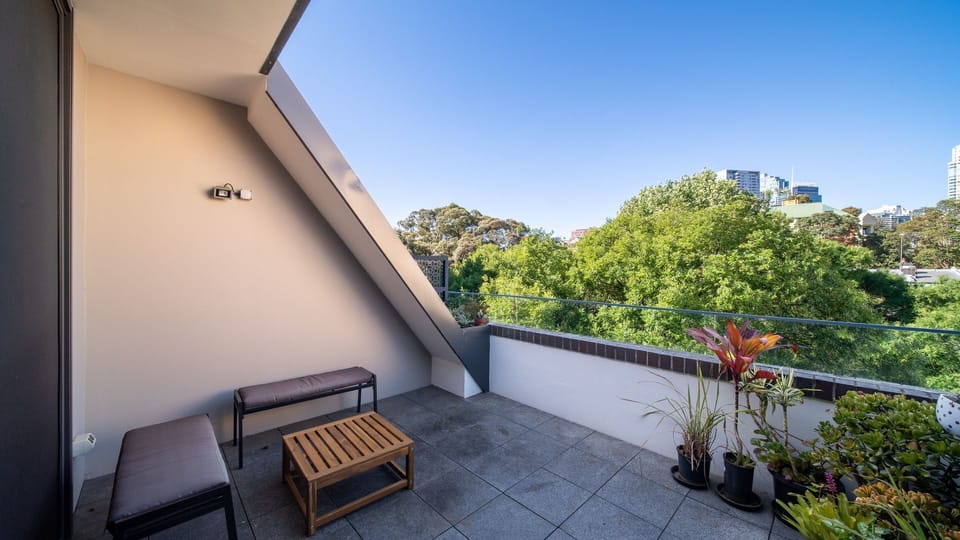 Private balcony with leafy outlook.