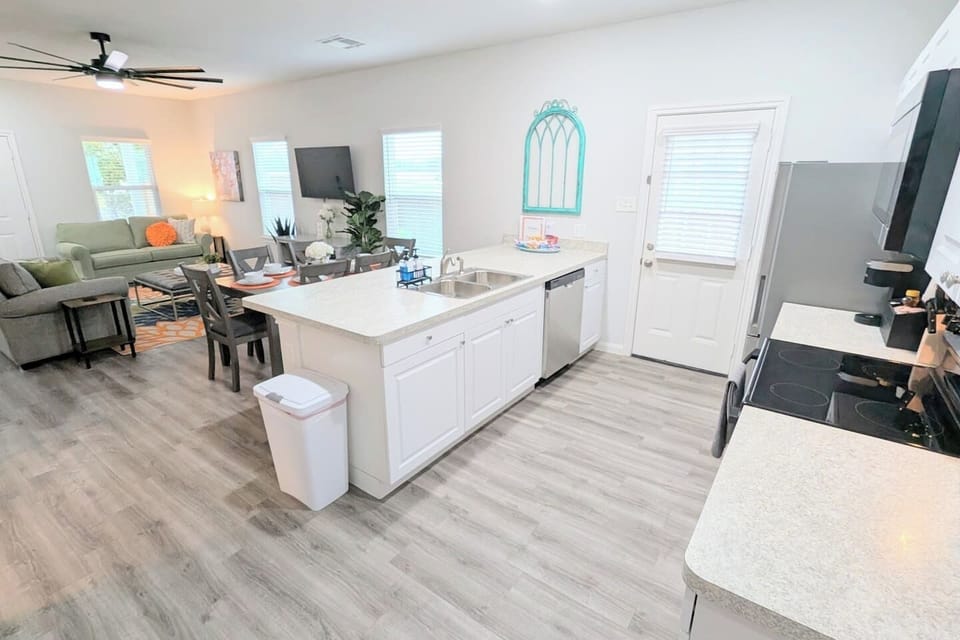 Open concept kitchen, living, and dining space makes it easy to spend time with family. 