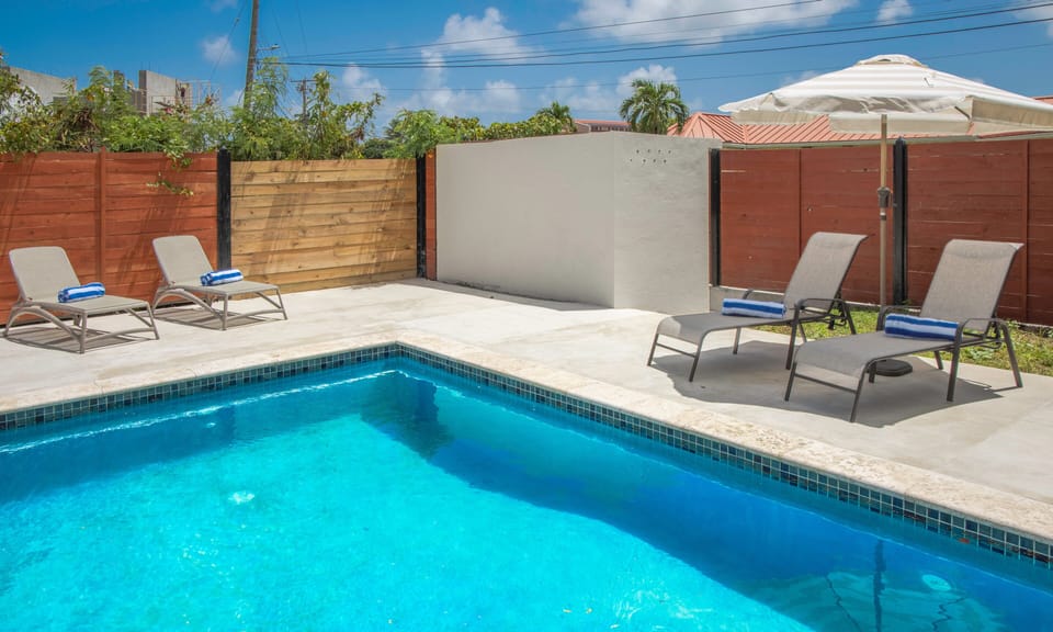 Pool with loungers and outdoor furniture