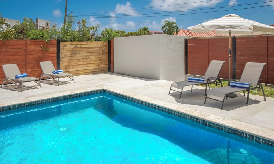 Pool with loungers and outdoor furniture