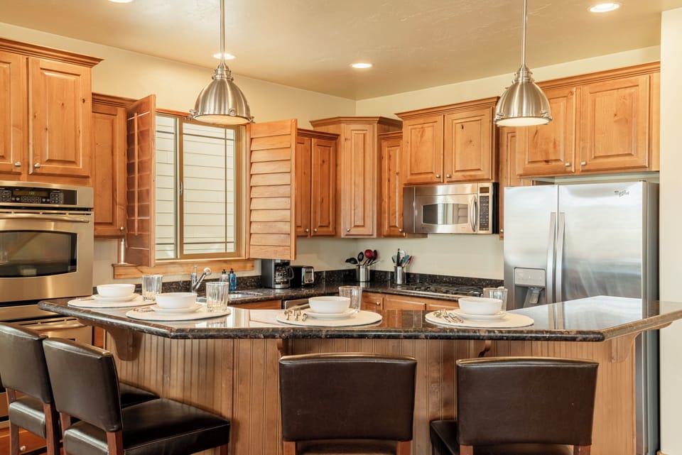 Fully equipped kitchen with stainless steel appliances.