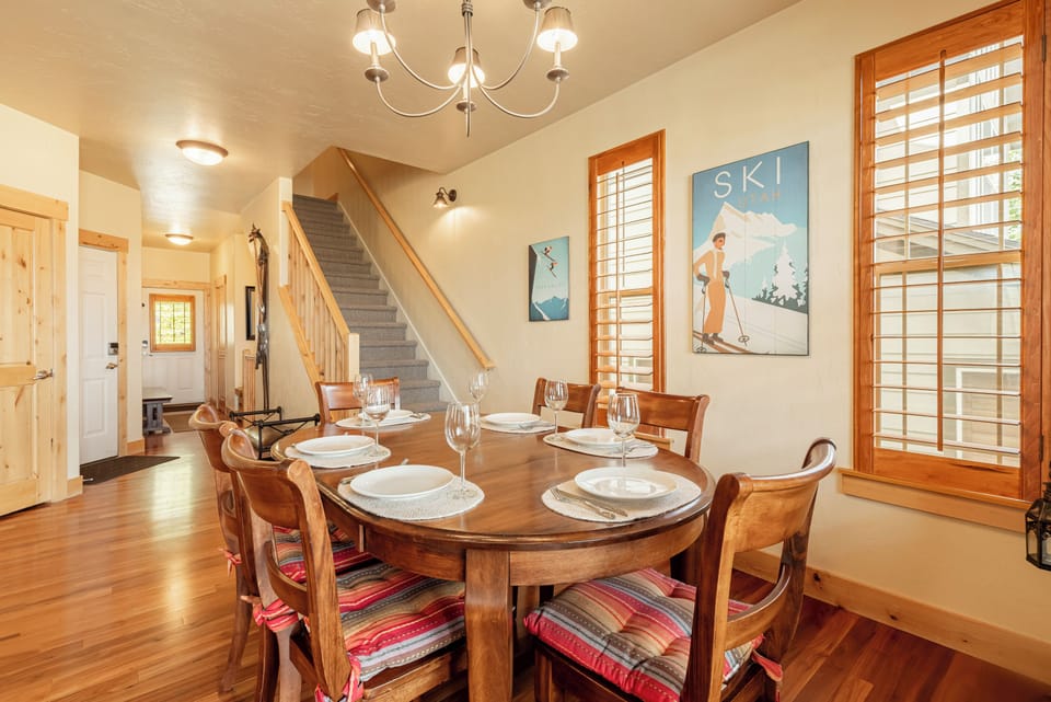 Dining area with open staircase to upper level.