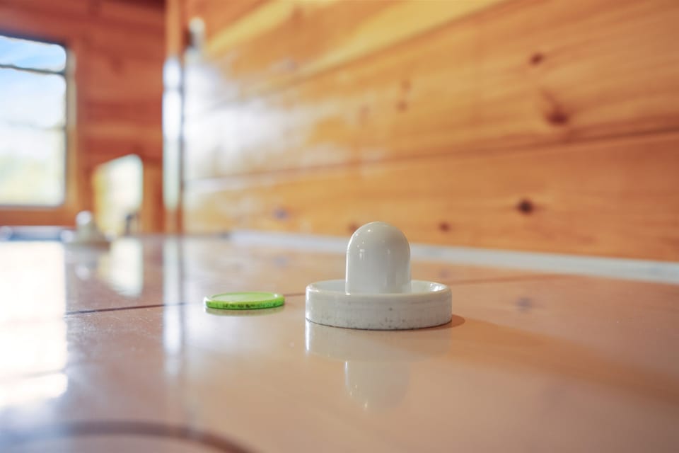 Bring out your competitive side with our air hockey table!