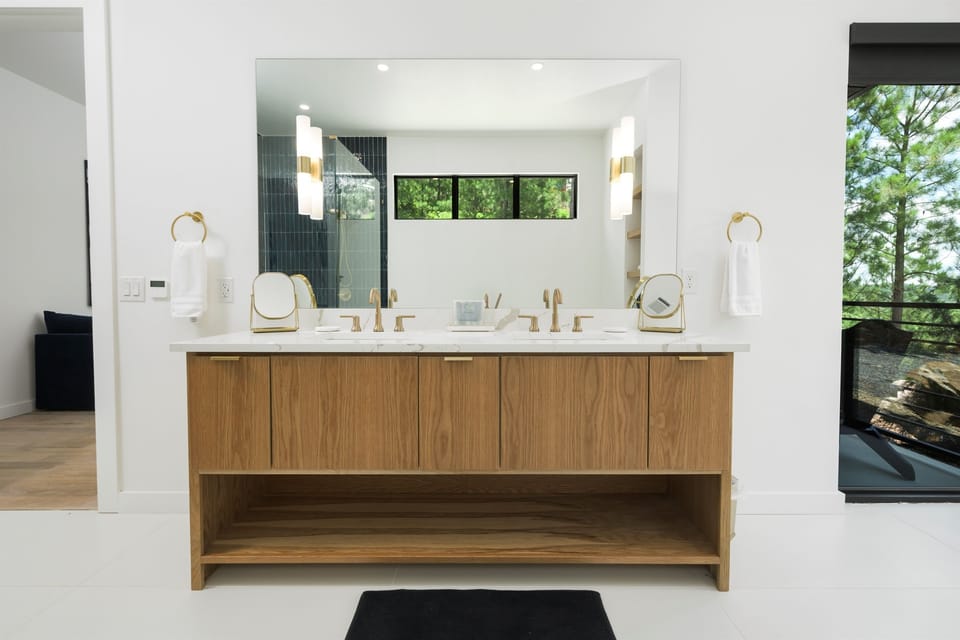 Sleek Bathroom Retreat: Enjoy elegant fixtures and serene views for a refreshing escape!