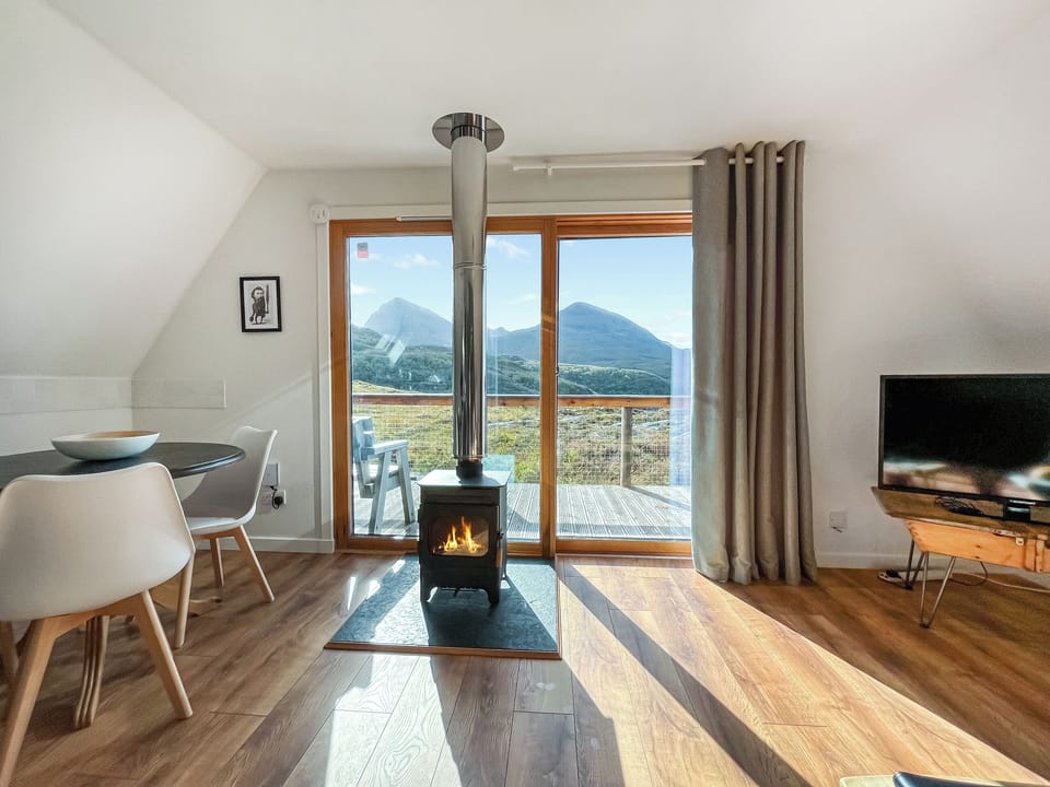 Fireplace & view | Torrin - Kylesku Lodges, Kylesku, near Lairg