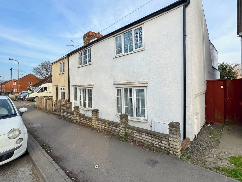 Front view of the property showing on-road parking | Riverside Cottage, Spalding