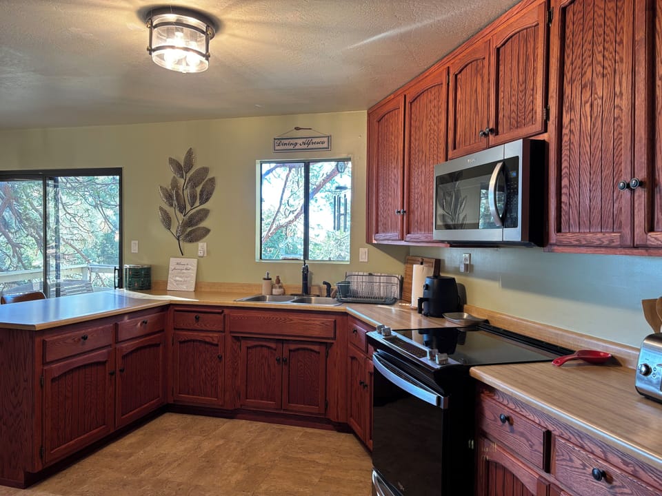 Full-size kitchen with lots of counter space and fully-stocked cabinets.