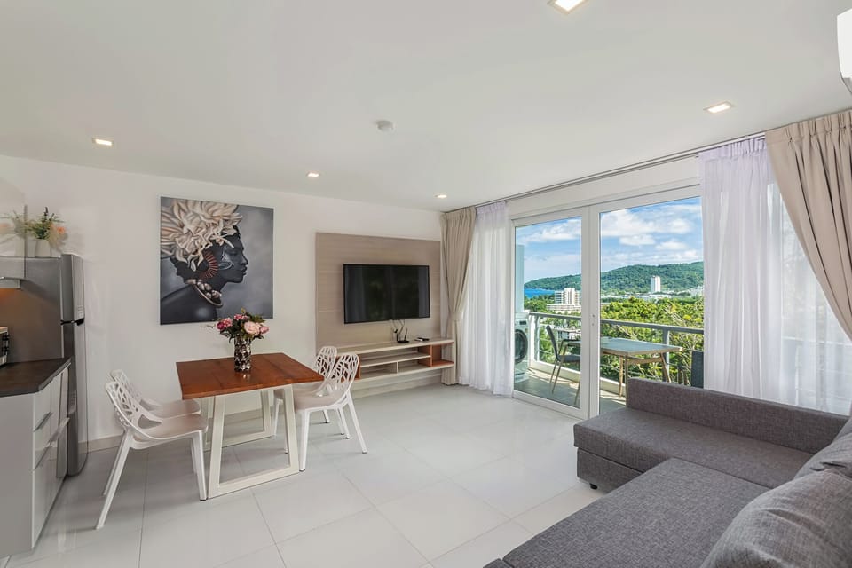 Standard Condo, Balcony, Sea View | Living area | Flat-screen TV