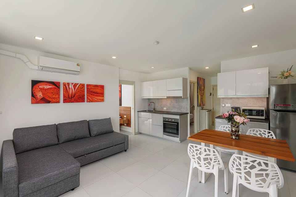 Standard Condo, Balcony, Sea View | Living area | Flat-screen TV