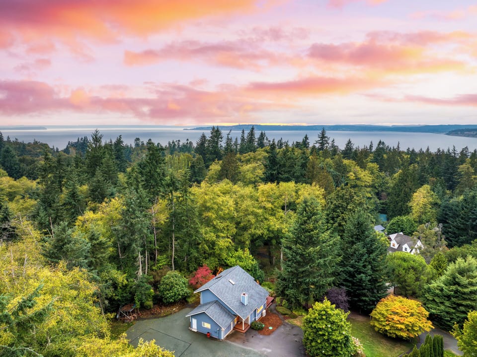 Scenic aerial view of the home among lush greenery.