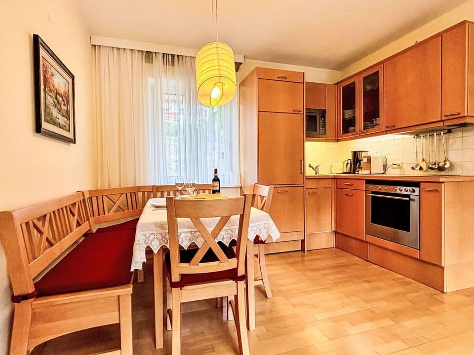 Furniture, Interior Design, Wood, Flooring, Floor, Lighting, Wood Flooring, Room, Table, Brown