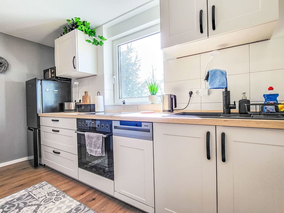 Kitchen Appliance, Kitchen, Countertop, Major Appliance, Cabinetry, Flooring, Interior Design, Wood, Furniture, Home Appliance