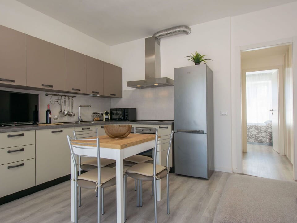 Furniture, Kitchen, Countertop, Interior Design, Flooring, Cabinetry, Kitchen Appliance, Wood, Floor, Major Appliance