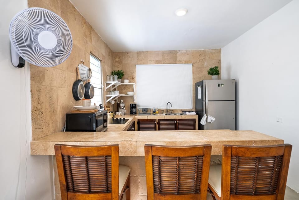 Inviting kitchen bar for casual meals and coffee.