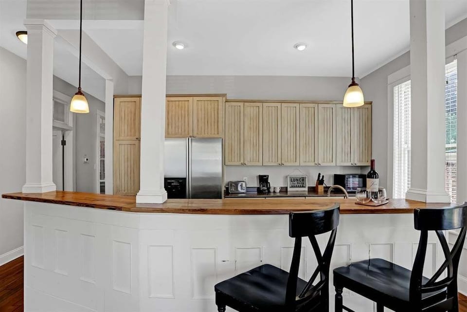 Pull up a barstool and enjoy casual meals or a glass of wine at the cozy kitchen island.