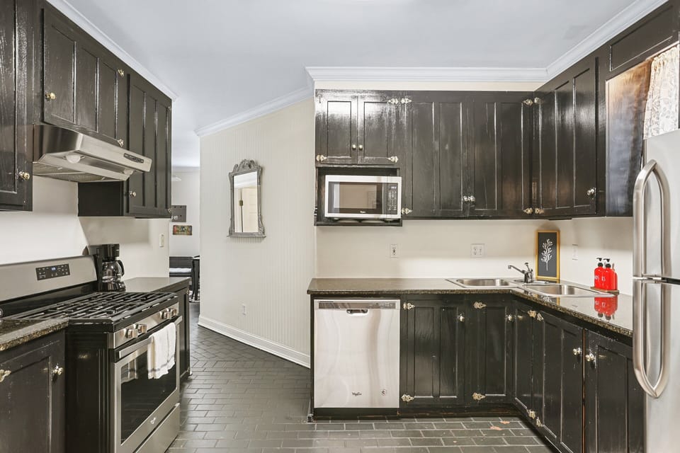 The fully equipped kitchen sits just off the dining room, offering everything needed to prepare meals during your stay.