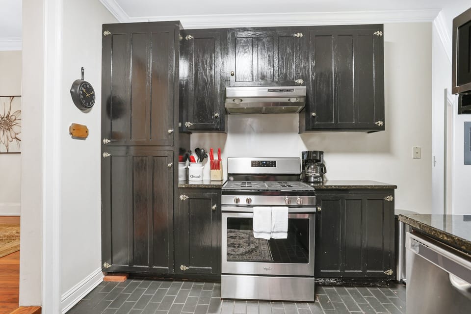 Stainless steel appliances provide reliable convenience while complementing the kitchen's timeless design.