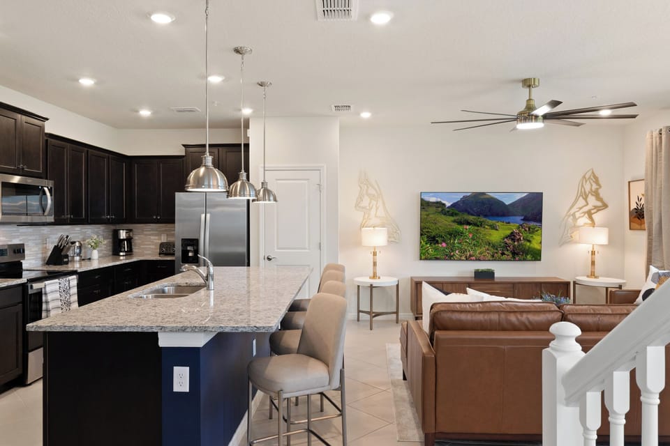 Spacious Downstairs Living Area with Full Size Kitchen, Dining Area, and Modern Lounge