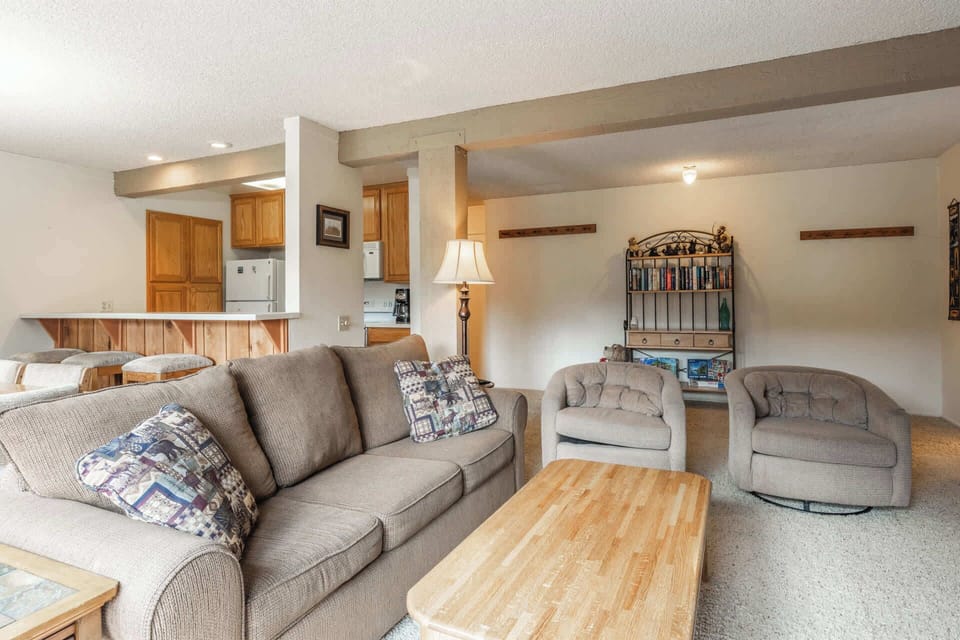 Cozy living room w/ smart TV, fireplace, sofa bed, & balcony access