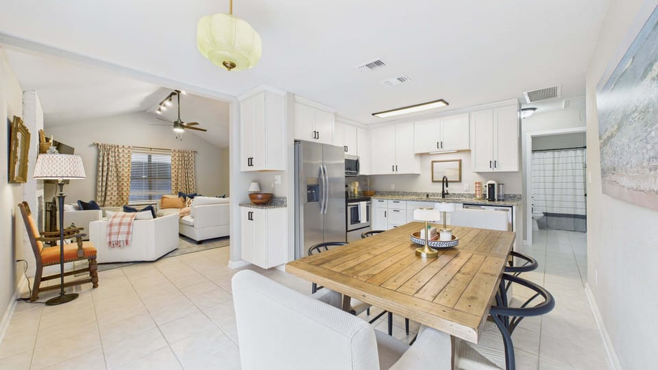 Fully equipped kitchen and dining table in kitchen area seating 6