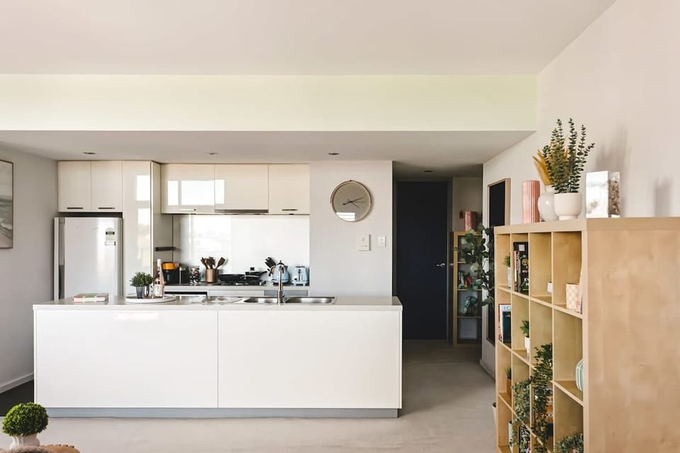 A large kitchen with island bench.
Our kitchen has everything you need for your home away from home.
