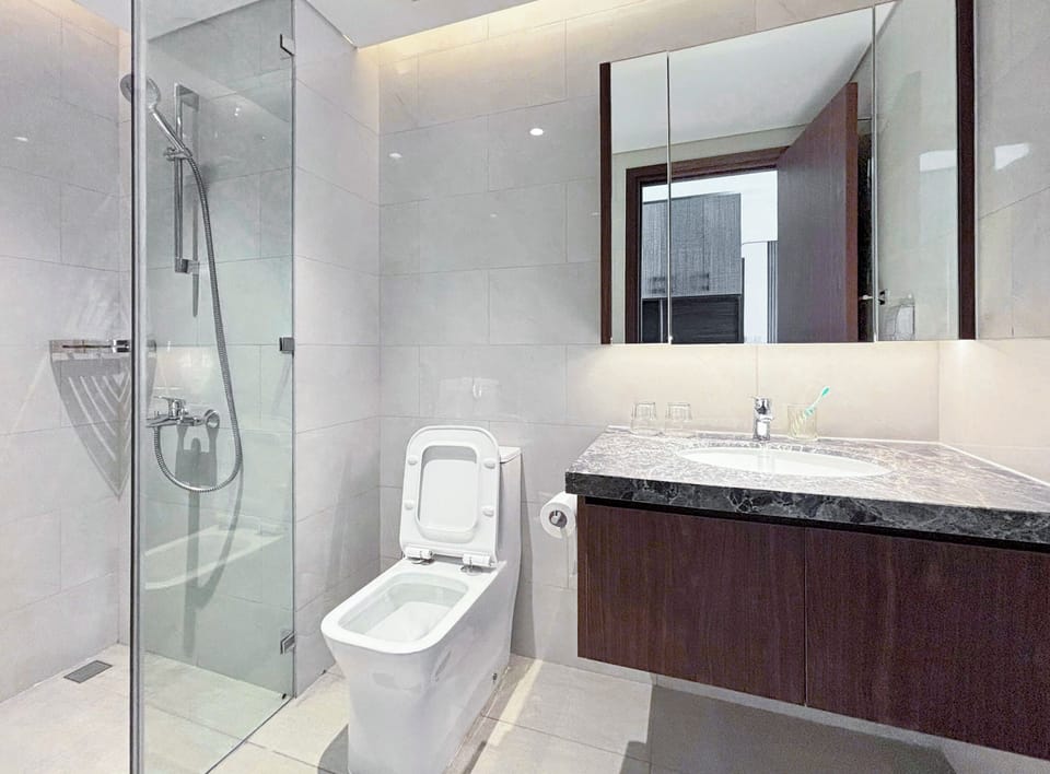 Shower, hair dryer, slippers, towels