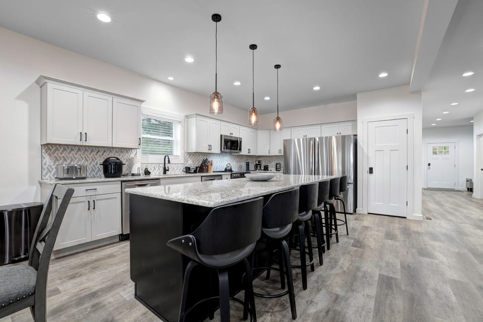 Gourmet kitchen with Island seating. 2 refrigerators, 2 dishwashers 