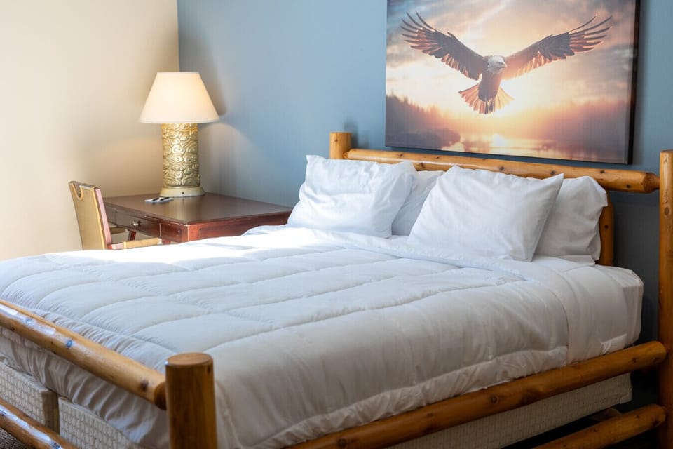 Private king bedroom featuring warm tones, plush bedding, and natural light.