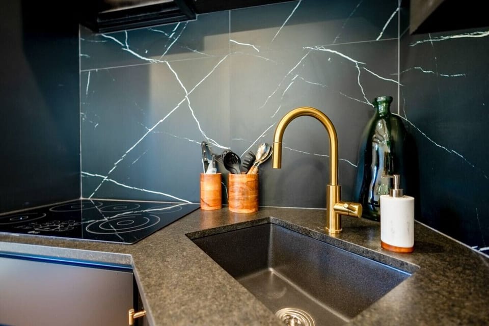 Stylish kitchen finishes featuring modern countertops and contemporary fixtures.