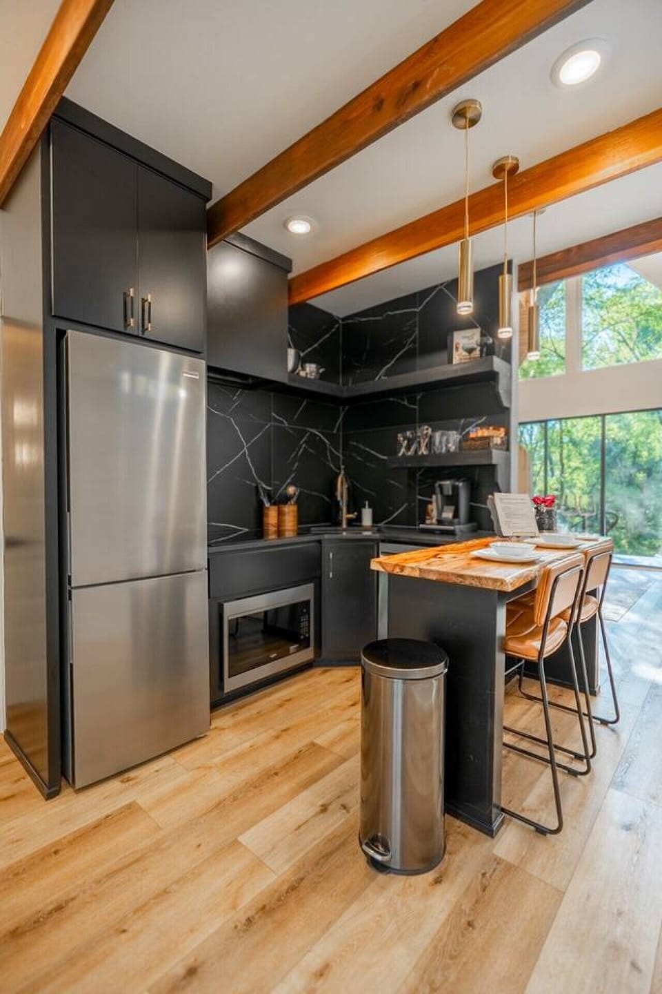 Contemporary kitchen featuring premium appliances, island seating, and thoughtful design.