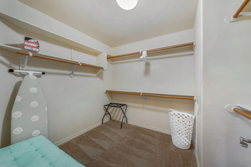 Primary bedroom`s spacious walk-in closet