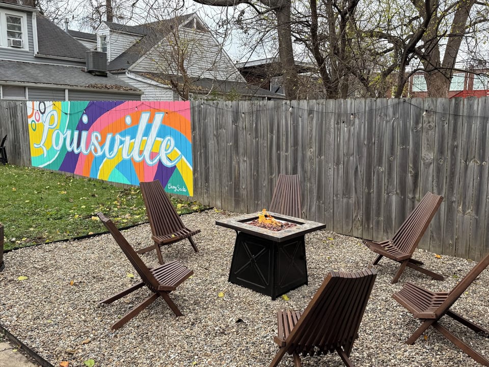 Enjoy the colorful Louisville mural while sitting around the fire with friends.